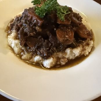 Rendez-Vous Bakery and Bistro - Beef short ribs over mashed potatoes - Bakeries Near Me - Oakland Park, Florida Rendez-Vous Bakery and Bistro - Beef short ribs over mashed potatoes - Bakeries Near Me - Oakland Park, Florida
