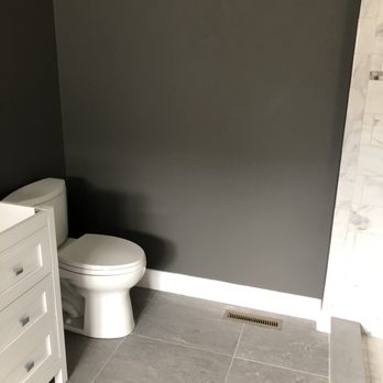 Kehoe Remodeling - a white toilet in a bathroom - General Contractors Near Me - Simsbury, Connecticut