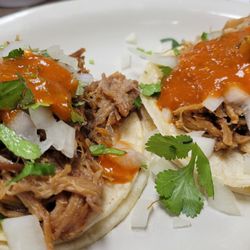 Tacos with carnitas. The pork is moist and delicious! (Yes, they do Taco Tuesdays.)
