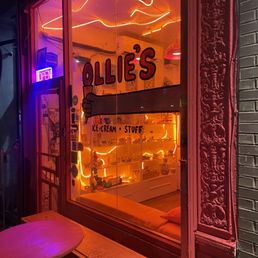 front of building, obsessed with all the neon