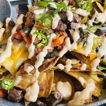 Lamplight Lounge - Lobster Nachos but order them Surf and Turf Nachos for an addition of steak! NOMS! FILLING AND GOOD! - New American Near Me - Anaheim, California