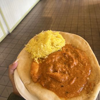Saffron Spice - Butter chicken with rice on naan bread - Indian Near Me - Seattle, Washington Saffron Spice - Butter chicken with rice on naan bread - Indian Near Me - Seattle, Washington