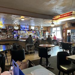 Silver Bullet Bar - Interior pic with many tables and a cool looking bar scene