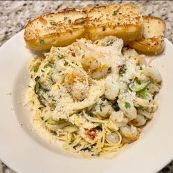 Skillets Country Kitchen - Pasta Primavera over angel hair with grilled shrimp, Parmesan, and a side of toasted garlic bread.