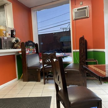 Taqueria El Cabrito - a table and chairs in a restaurant - Mexican Near Me - Arbutus, Maryland Taqueria El Cabrito - a table and chairs in a restaurant - Mexican Near Me - Arbutus, Maryland