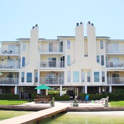 Dexter's Beach Home - Exterior view from the water. Dexter's Beach Home is the top two floors on the left.