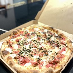 Another amazing pie! 18" NY pizza with ricotta, sausage and basil. This place needs awards. Another amazing pie! 18" NY pizza with ricotta, sausage and basil. This place needs awards.