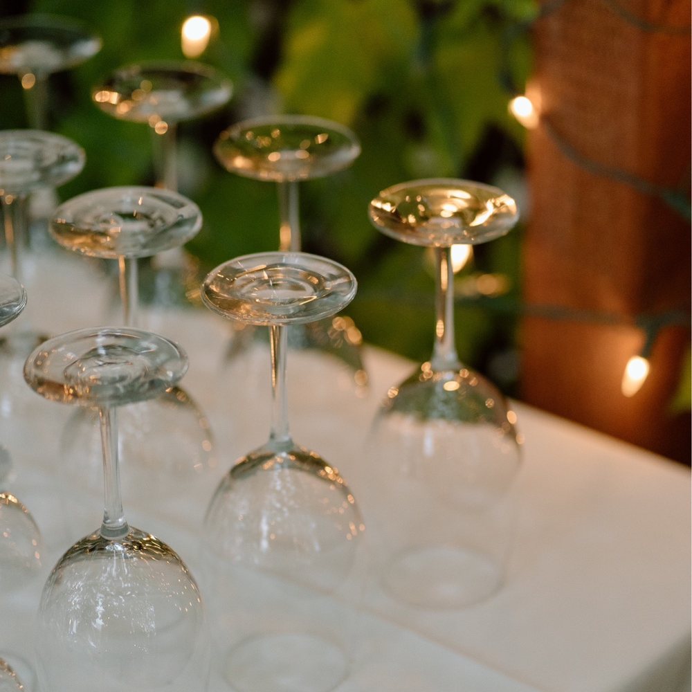 Red Tavern - a row of wine glasses on a table - New American Near Me - Chico, California Red Tavern - a row of wine glasses on a table - New American Near Me - Chico, California