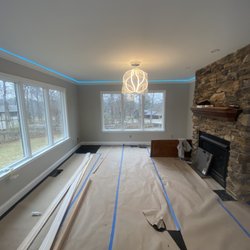 Handyman On Demand - Smart LED strips installed with crown molding in living room and repainted the room