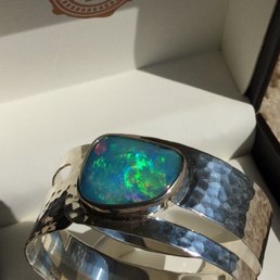 Gorgeous custom made silver and opal bangle made by the artisans at Impress Jewelry Creations in Granger Indiana