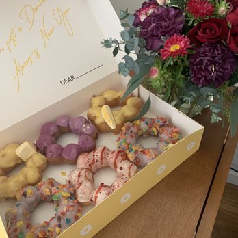 Mochinut - Seattle - Mango, ube, fruity pebbles, and raspberry. - Donuts Near Me - Seattle, Washington Mochinut - Seattle - Mango, ube, fruity pebbles, and raspberry. - Donuts Near Me - Seattle, Washington