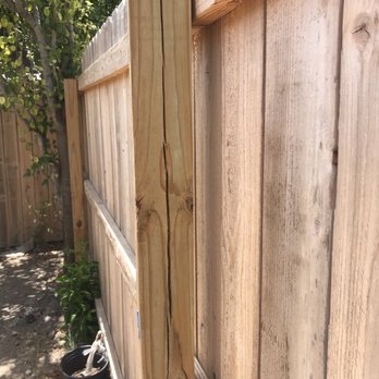 Queta Construction Group - a wooden fence with a hole in it - Decks & Railing Near Me - San Antonio, Texas Queta Construction Group - a wooden fence with a hole in it - Decks & Railing Near Me - San Antonio, Texas