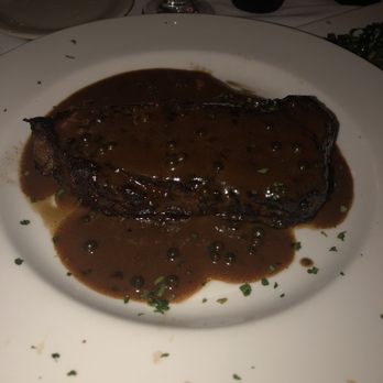 Runyon's - 14oz strip steak with speciality sauce - New American Near Me - Coral Springs, Florida Runyon's - 14oz strip steak with speciality sauce - New American Near Me - Coral Springs, Florida
