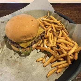 Smash House Tavern - Jalapeño popper smash burger with fries. - Sports Bars Near Me - Bloomington, Illinois Smash House Tavern - Jalapeño popper smash burger with fries. - Sports Bars Near Me - Bloomington, Illinois