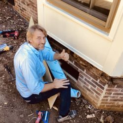 Andrei Home Repair Services - Andrei putting flashing around rotted wood under the bay window.