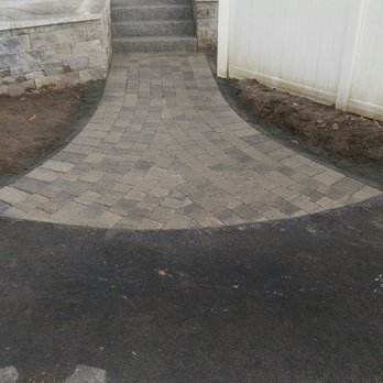 South River Landscape - a paved driveway with steps leading up to a white fence - Landscaping Near Me - Pembroke, Massachusetts South River Landscape - a paved driveway with steps leading up to a white fence - Landscaping Near Me - Pembroke, Massachusetts