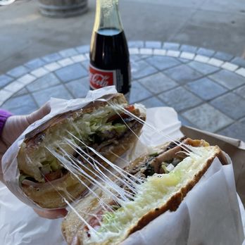 Acambaro Bakery - a person holding a sandwich - Mexican Near Me - Soledad, California Acambaro Bakery - a person holding a sandwich - Mexican Near Me - Soledad, California
