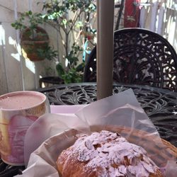 Sucré Salé Delicatessen - Almond and cream croissant in the calm shadow of the small garden in the busy avenida universidad