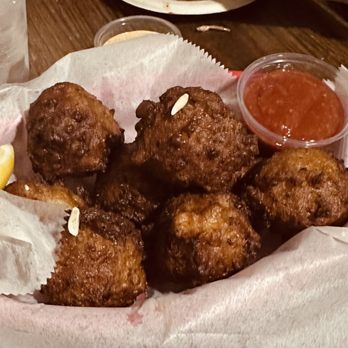 Tide Tables - Over deep fried conch fritters - Seafood Near Me - Cortez, Florida