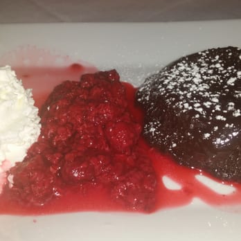 Bistro 44 - Molten chocolate lava cake with whipped cream and fruit compote - New American Near Me - Northport, New York Bistro 44 - Molten chocolate lava cake with whipped cream and fruit compote - New American Near Me - Northport, New York