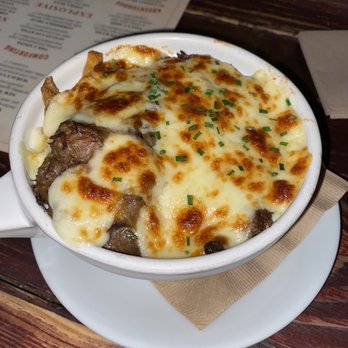 The State - Poutine= Brisket, fries and cheese in light gravy. - New American Near Me - Redlands, California