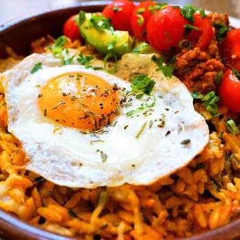 Medina Cafe - Paella: sunny egg, orzo, chorizo sausage, roasted vegetables, grana padano, avocado, spicy charred tomato salsa ($18). - Breakfast & Brunch Near Me - Vancouver, British Columbia Medina Cafe - Paella: sunny egg, orzo, chorizo sausage, roasted vegetables, grana padano, avocado, spicy charred tomato salsa ($18). - Breakfast & Brunch Near Me - Vancouver, British Columbia