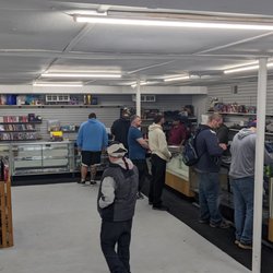 Hero City Cards & Games - Card counter busy with eager customers!