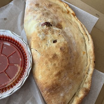 Leo's Pizza - Large meat lovers calzone. Enough to feed a family. Out of this world.! Highly recommend it. And as usual, all the staff was amazing - Pizza Near Me - West Palm Beach, Florida Leo's Pizza - Large meat lovers calzone. Enough to feed a family. Out of this world.! Highly recommend it. And as usual, all the staff was amazing - Pizza Near Me - West Palm Beach, Florida