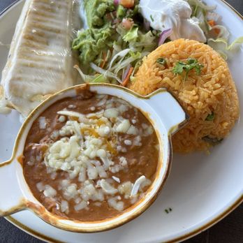 Aguacates Mexican Cantina - Lunch Chimichanga with Mexican rice, beans and salad - Mexican Near Me - Buffalo, New York Aguacates Mexican Cantina - Lunch Chimichanga with Mexican rice, beans and salad - Mexican Near Me - Buffalo, New York