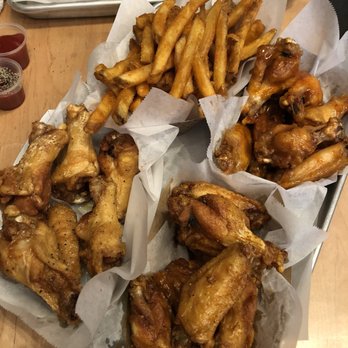 Fire Wings - Lemon pepper wings (top), Malaysian curry wings (bottom left), mango habanero wings (bottom Right, under fries) - Chicken Wings Near Me - San Mateo, California