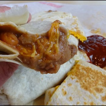 Del Taco - One bite into my "Bean and Cheese Burrito" shows all of the refried bean and melted Cheddar cheese goodness. - Fast Food Near Me - Roseville, California Del Taco - One bite into my "Bean and Cheese Burrito" shows all of the refried bean and melted Cheddar cheese goodness. - Fast Food Near Me - Roseville, California