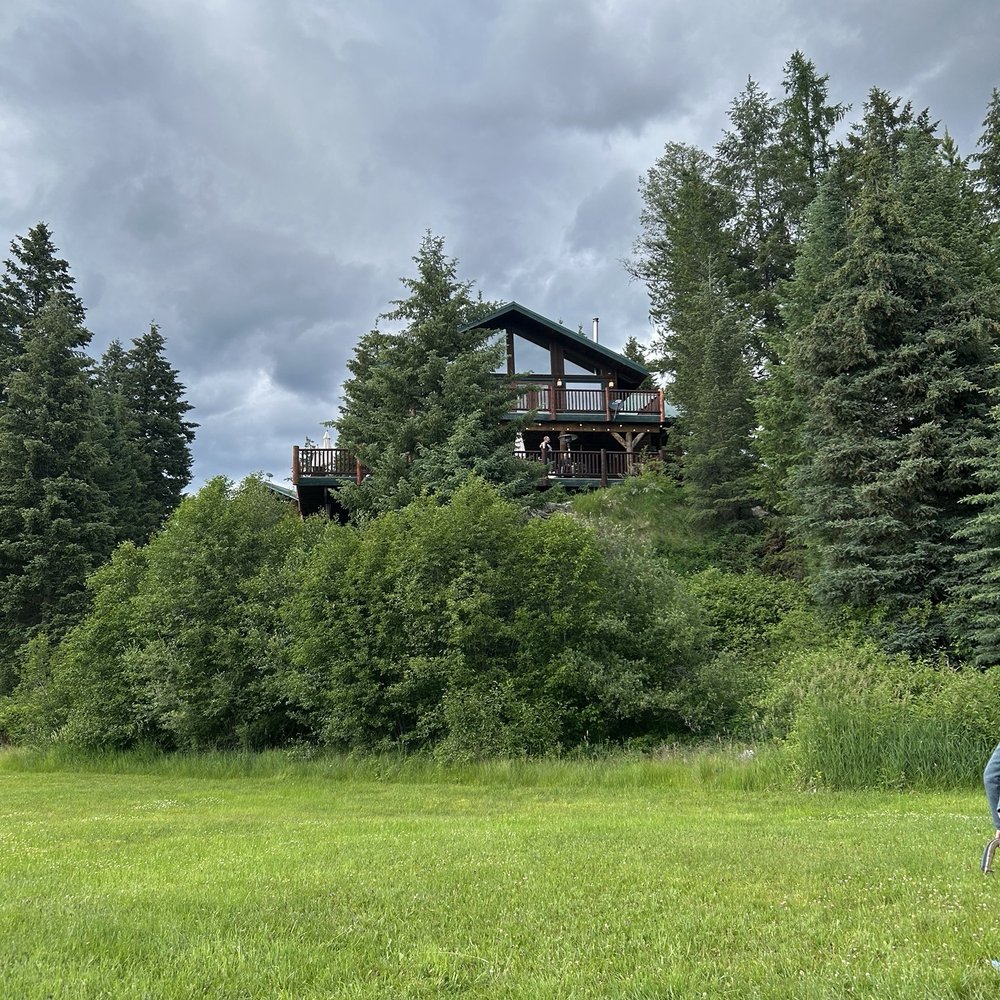 Dog Creek Lodge - View looking up from the meadow - Hotels Near Me - Olney, Montana Dog Creek Lodge - View looking up from the meadow - Hotels Near Me - Olney, Montana
