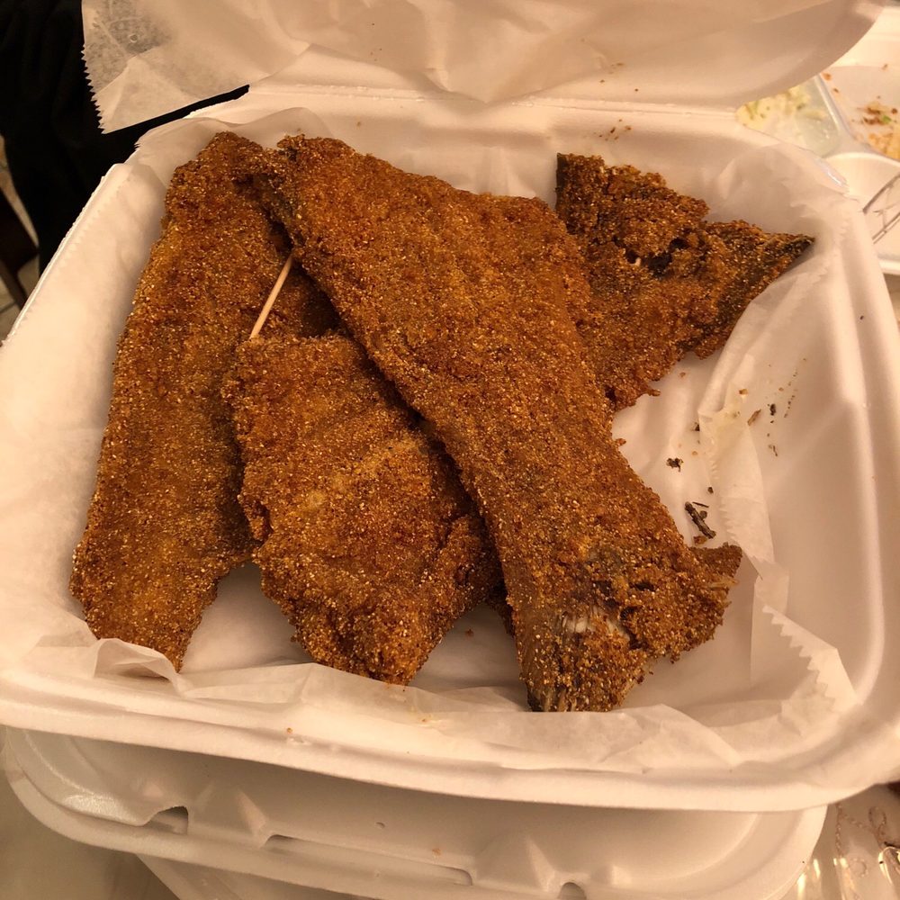 fried chicken strips in a styrofoam container fried chicken strips in a styrofoam container
