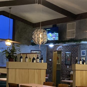 Ellinya Italian - a dining room with a ceiling fan - Italian Near Me - Corsicana, Texas Ellinya Italian - a dining room with a ceiling fan - Italian Near Me - Corsicana, Texas