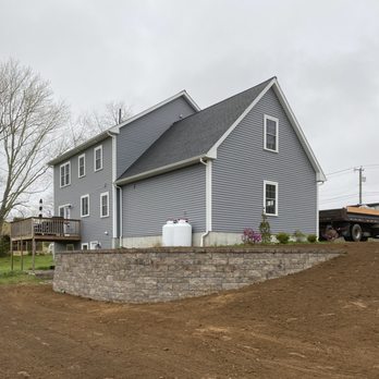 Lyon & Company Landscaping - a house with a retaining wall - Landscaping Near Me - Brooklyn, Connecticut Lyon & Company Landscaping - a house with a retaining wall - Landscaping Near Me - Brooklyn, Connecticut
