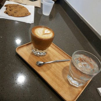 9Bar HNL - Cortados and chocolate cookie with water served on the side. - Coffee & Tea Near Me - Honolulu, Hawaii 9Bar HNL - Cortados and chocolate cookie with water served on the side. - Coffee & Tea Near Me - Honolulu, Hawaii