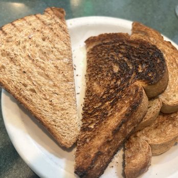 Metro Diner - Toast (tried to conceal burnt piece) - American Near Me - Raleigh, North Carolina Metro Diner - Toast (tried to conceal burnt piece) - American Near Me - Raleigh, North Carolina