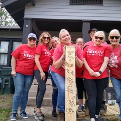 Rose Rock Habitat for Humanity ReStore - Keller Williams hosts an annual Red Day volunteer day. These amazing ladies built a much needed ramp & signed the underside of the toe board