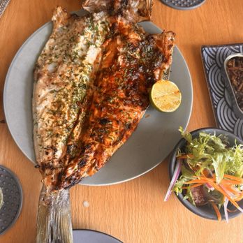 Ictio - Fresh catch of the day (Seabass grilled with Ictio and garlic butter salsa) - Seafood Near Me - Playa del Carmen, ROO