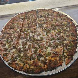 16 Inch square cut pizza perfectly done with toppings to the edge! 16 Inch square cut pizza perfectly done with toppings to the edge!