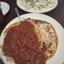 Roma's Italian Restaurant - Eggplant Parmesan and fettuccine with mushrooms chicken Alfredo.