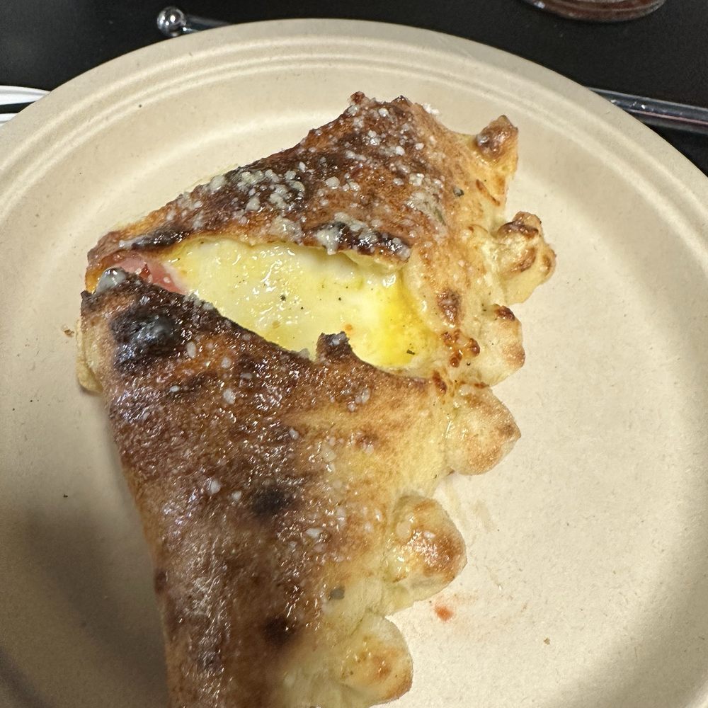 Table Rock Pizza - A pice of the calzone. - Pizza Near Me - Millersburg, Ohio Table Rock Pizza - A pice of the calzone. - Pizza Near Me - Millersburg, Ohio