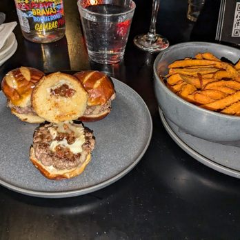 Dutch Freds - Guinness Waygu Beef Sliders with Brie Cheese, Bacon Jam and Garlic Aoli with Sweet Potato Fries - Cocktail Bars Near Me - New York, New York Dutch Freds - Guinness Waygu Beef Sliders with Brie Cheese, Bacon Jam and Garlic Aoli with Sweet Potato Fries - Cocktail Bars Near Me - New York, New York