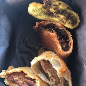 The Empanada Company - From top to bottom: curry chicken, cajun pork, bacon-apple-cheese, smoked chorizo - Latin American Near Me - Etobicoke, Ontario