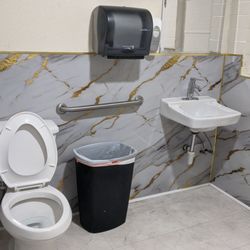 Tire Experts - Bathroom.  Like Del Taco, you have to go outside and it is at the east end of the building.
