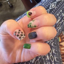 Silly green and purple nails with a frog and lady bug