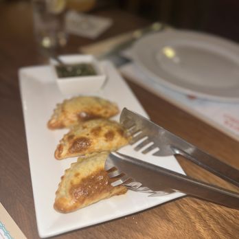 Corrientes 348 Argentinian Steakhouse - a fork and knife on a plate - Argentine Near Me - Dallas, Texas Corrientes 348 Argentinian Steakhouse - a fork and knife on a plate - Argentine Near Me - Dallas, Texas
