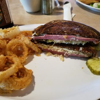 The Rustic - Reuben Sandwich wit a side of Onion Rings - New American Near Me - Fort Calhoun, Nebraska The Rustic - Reuben Sandwich wit a side of Onion Rings - New American Near Me - Fort Calhoun, Nebraska
