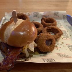 Burger Theory - Bacon cheese burger with onion rings.