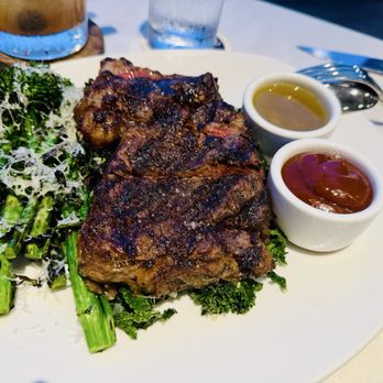 Quiora - Snake River Farms American Wagyu Steak with sides of grilled broccolini and garlic-braised kale - Italian Near Me - Honolulu, Hawaii